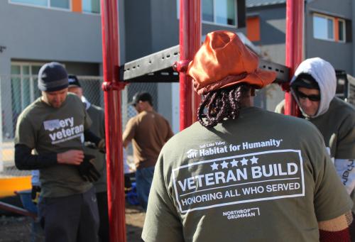 Image of veterans assembling a metal playground structure